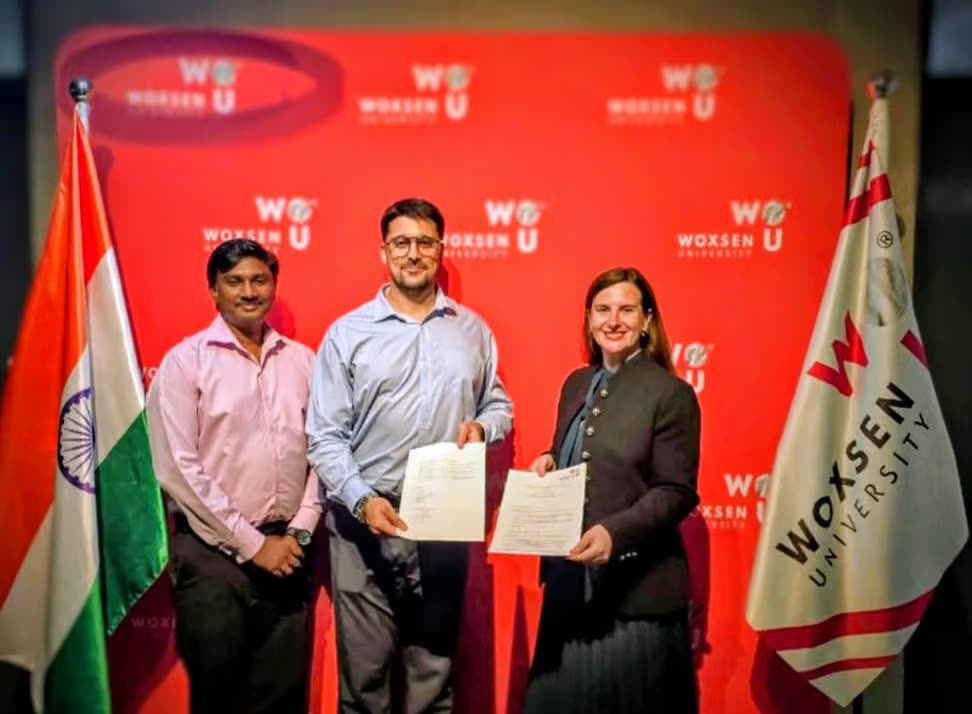 Memorandum of understanding signed against a Woxsen University backdrop