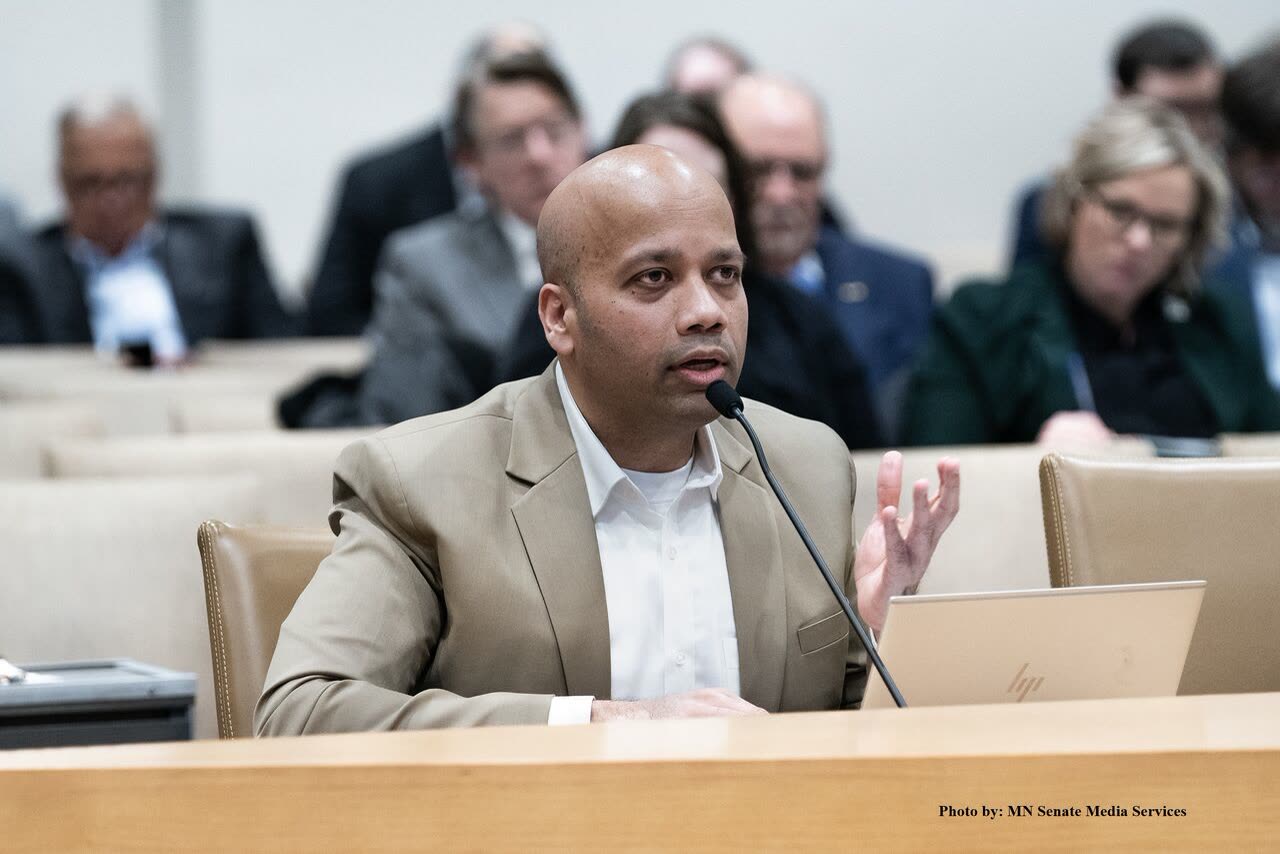 Delegate speaking into a microphone during a panel session